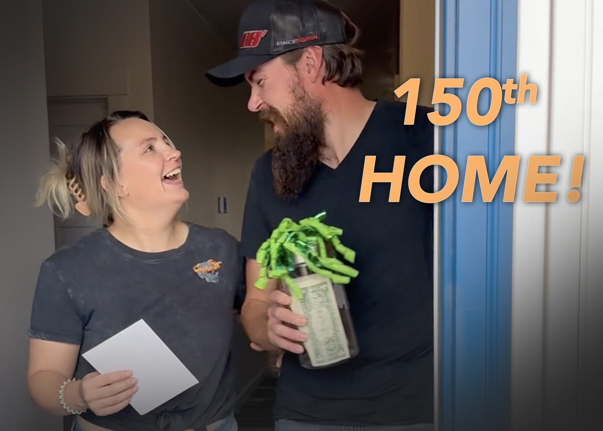 excited homeowners smile at each other when they receive $150 cash